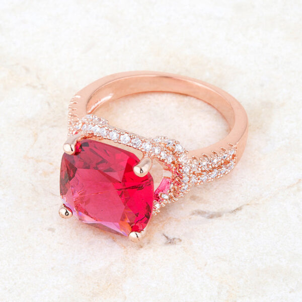 Ruby-colored cubic zirconia in a prong setting on a classic statement ring measuring 2.2mm wide.