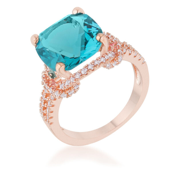 Classic aqua cubic zirconia statement ring in cushion and round cuts, held in prongs, with a rose gold tone over lead free alloy (brass) finish.
