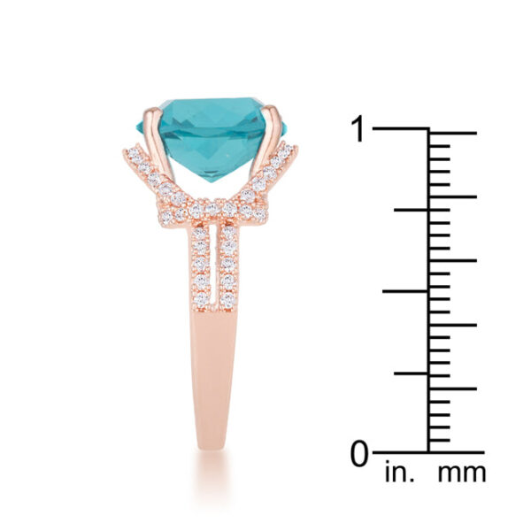 Rose gold tone over lead free alloy (brass) classic ring with aqua cubic zirconia held in prongs.