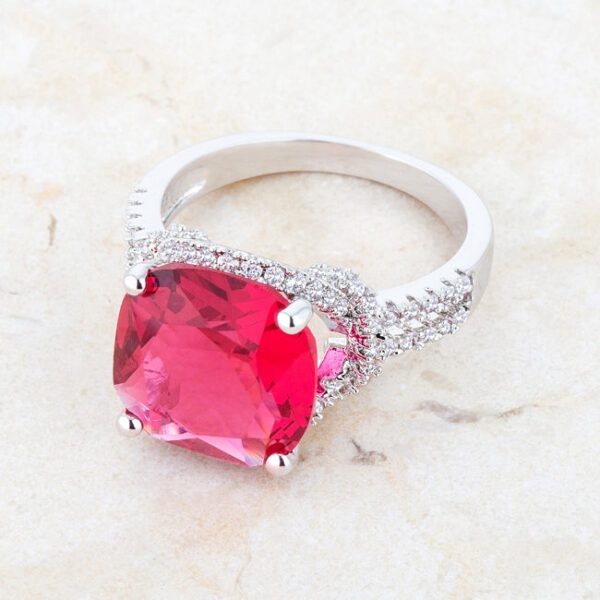 Classic statement ring in rhodium plated over lead free alloy (brass), with a round ruby-colored cubic zirconia.