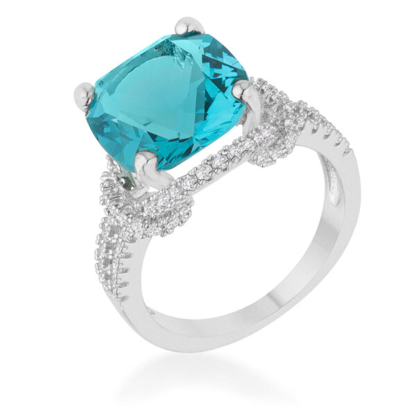 Aqua cubic zirconia statement ring in rhodium plated over lead free alloy (brass) with cushion and round cuts in prongs.