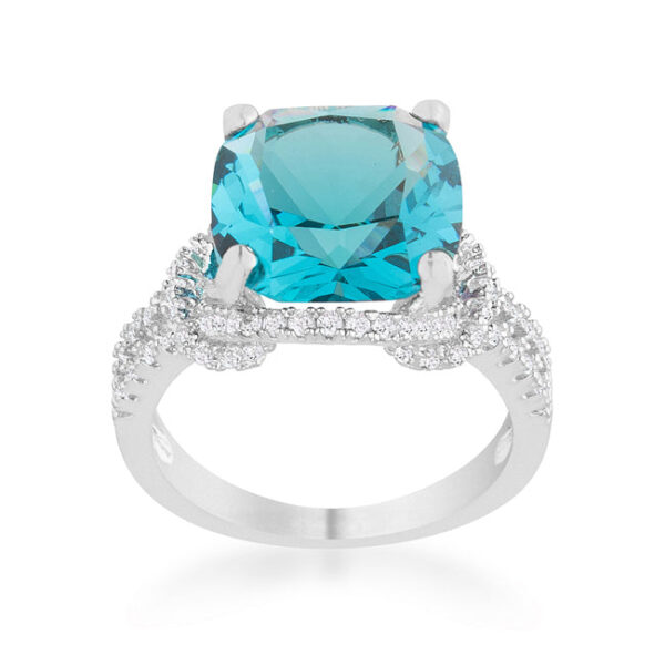Aqua cubic zirconia ring in rhodium plated over lead free alloy (brass), with cushion and round cuts held in prongs.