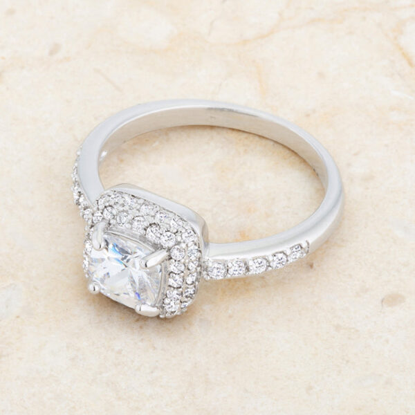 Art Deco ring with 1.5 ct total weight of clear cushion cut cubic zirconia and rhodium plated over lead free alloy (brass).