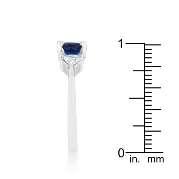 Sapphire-colored cubic zirconia ring with cushion and trillion cuts in a prong setting.