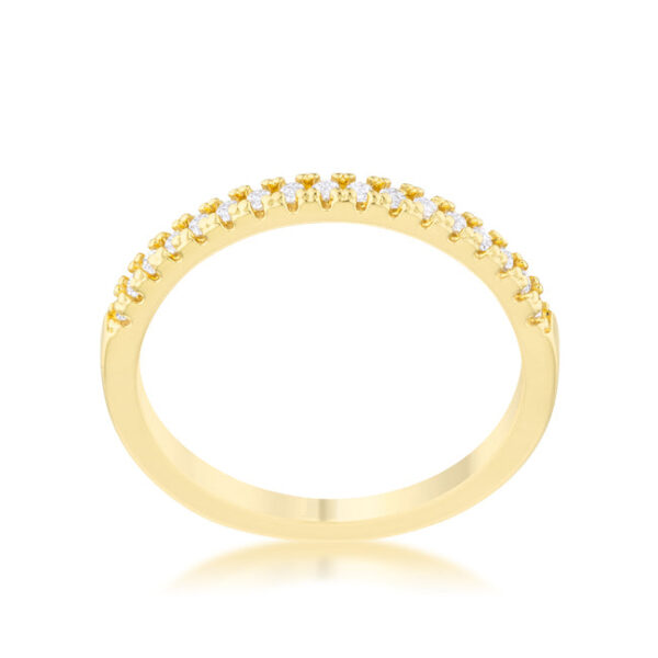Round clear cubic zirconia accent stones measuring 1.15 Mm in the channel setting of a delicate band ring.