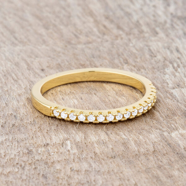 Gold tone over lead free alloy (brass) band ring with round clear cubic zirconia in a channel setting.
