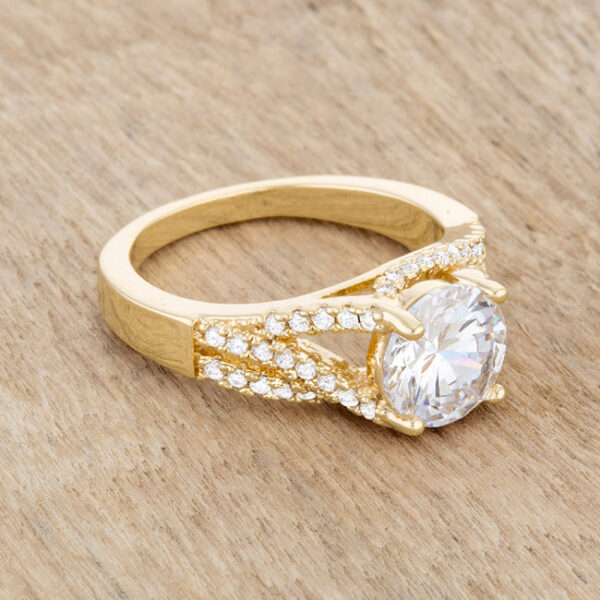 Gold tone over lead free alloy (brass) classic ring with round cubic zirconia held in prong settings.