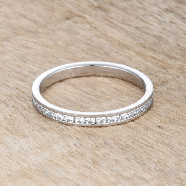 Channel-set clear round cubic zirconia eternity band in silver tone over stainless steel.