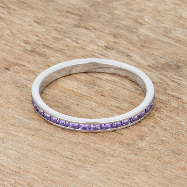 Close-up of the channel setting showing individual round amethyst-colored cubic zirconia in the band