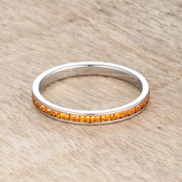 Channel-set round orange cubic zirconia eternity band with silver tone over stainless steel.