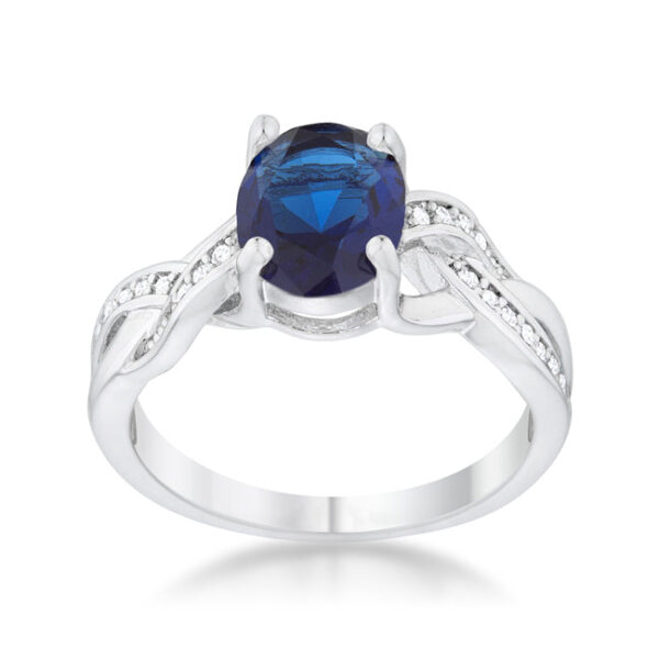 Classic oval ring in rhodium plated over lead free alloy (brass) with a 2 Mm band and sapphire-colored cubic zirconia.