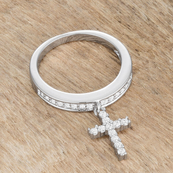 Cross charm ring rhodium plated over lead free alloy (brass) with round cubic zirconia.