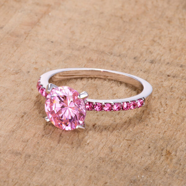 Classic pink cubic zirconia ring, pave set with 8mm stones on rhodium plated over lead free alloy (brass).