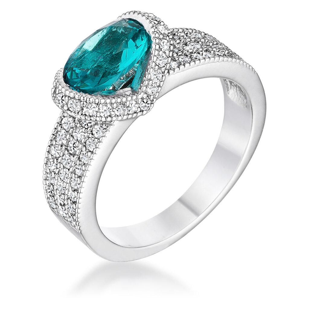 Aqua oval cubic zirconia ring in a prong setting, rhodium plated over lead free alloy (brass).