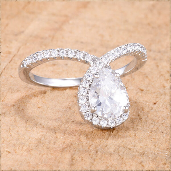 Round clear cubic zirconia chevron ring with rhodium plating and prong settings