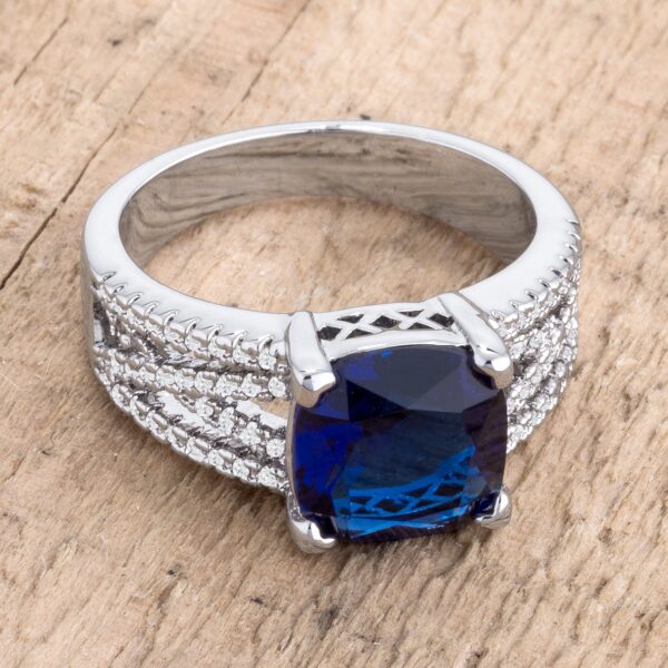 Classic criss-cross ring with sapphire-colored cubic zirconia in prong settings and a 3.8mm band.