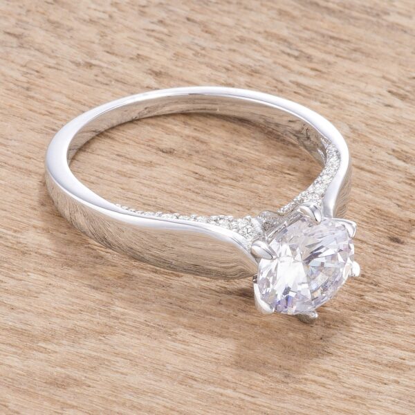 Classic contemporary solitaire ring with round prong-set cubic zirconia in rhodium plated over lead free alloy (brass).
