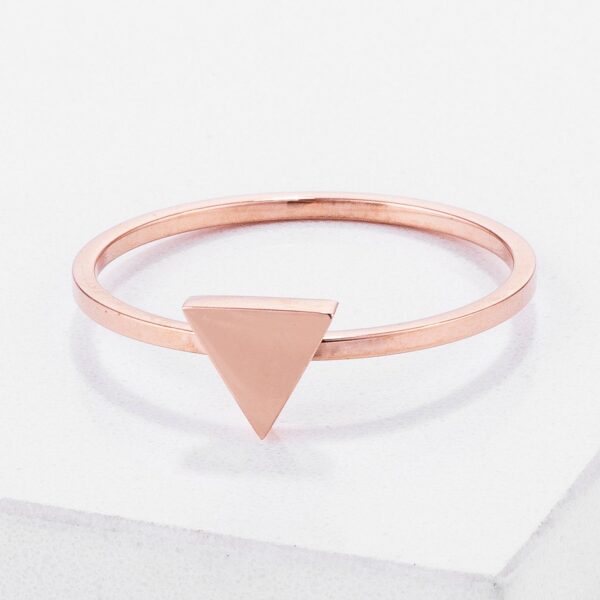 Rose gold plated stainless steel triangle stackable ring shown at an angle