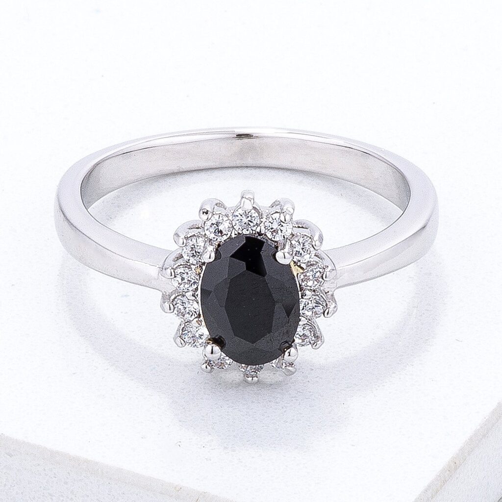 Petite oval ring with a black cubic zirconia stone set in silvertone plated brass