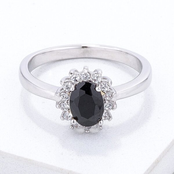 Petite oval ring with a black cubic zirconia stone set in silvertone plated brass
