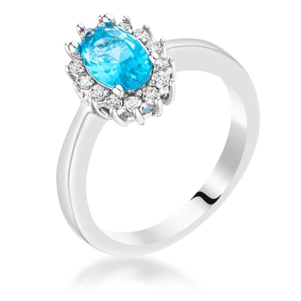 Blue oval cubic zirconia ring in a prong setting with a silver tone over brass finish.