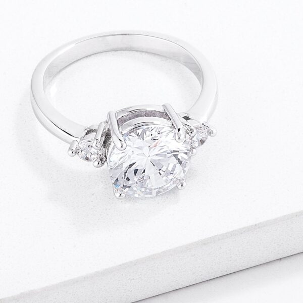 Classic three-stone clear round cubic zirconia engagement ring with 2.97 ct total stone weight.