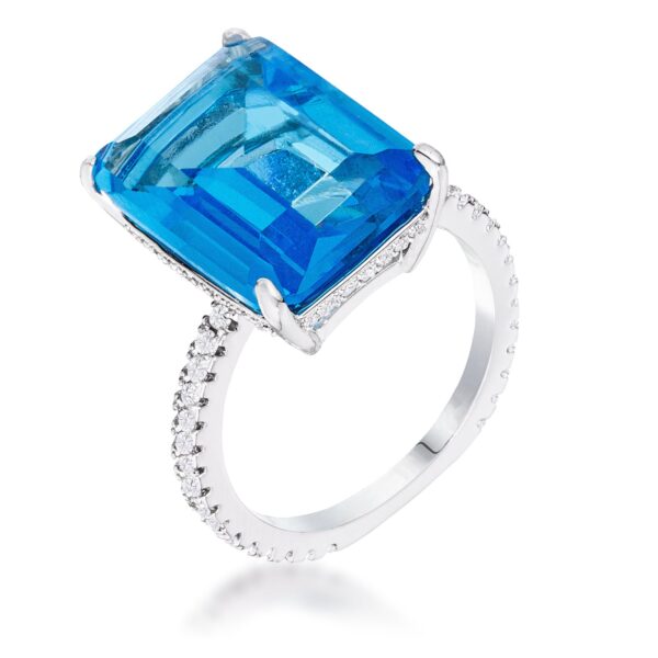 Cocktail ring with a light blue cubic zirconia center stone and a pave-set band of cubic zirconia