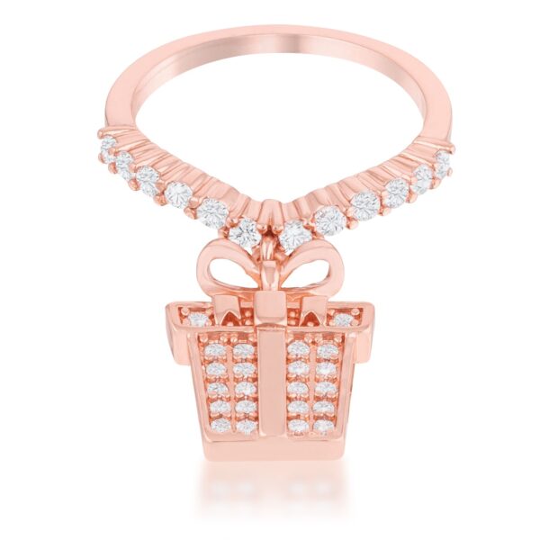 Rose goldtone plated ring with a bow and gift box charm set with round cubic zirconia stones in a pave setting