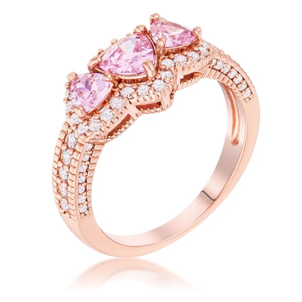 Rose gold tone over brass ring with 3 pink trillion cut cubic zirconia stones in a halo pave design