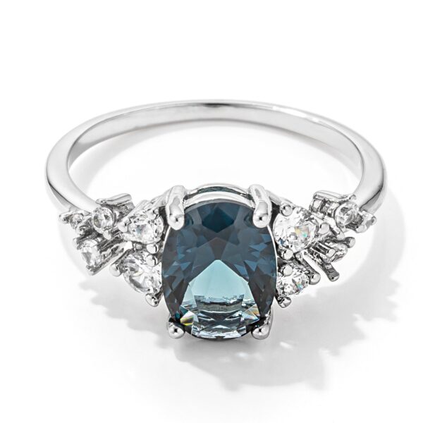 Blue oval-cut cubic zirconia engagement ring, rhodium finish plated over lead free alloy (brass), with 2.95 ct total weight.