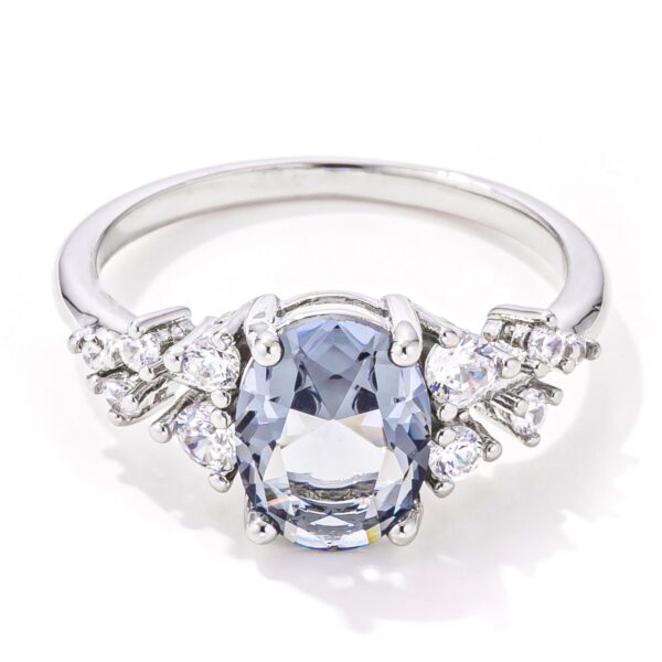 Grey oval-cut cubic zirconia engagement ring, rhodium finish plated over lead free alloy (brass), with 2.95 ct total carat weight.