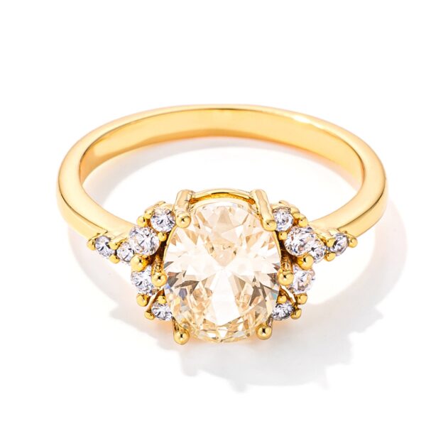 Oval canary yellow cubic zirconia engagement ring in gold tone over lead free alloy (brass).
