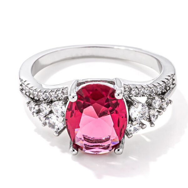 Raspberry sparkle ring in rhodium finish plated over lead free alloy (brass) with oval cubic zirconia and 3.25 ct total weight.