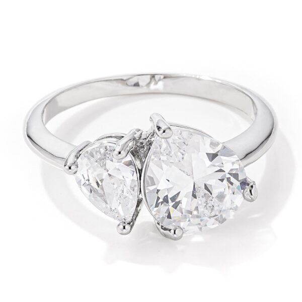 Toi et moi ring with pear-cut cubic zirconia, 2.75 ct total stone weight, and rhodium plated over lead free alloy (brass).