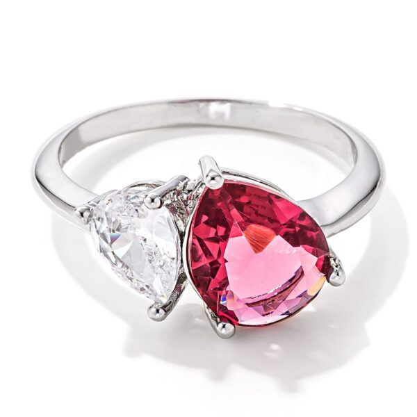 Clear and rose pink pear-cut cubic zirconia toi et moi ring, rhodium plated over lead free alloy (brass).