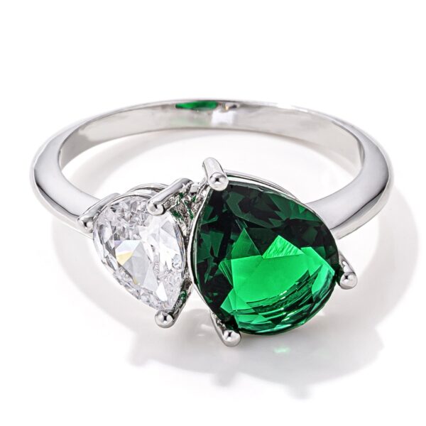 Clear green pear cut cubic zirconia toi et moi ring in rhodium plated over lead free alloy (brass).