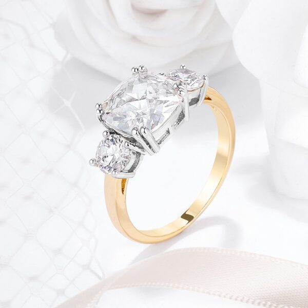 Classic engagement-style ring with cushion and round cubic zirconia in a prong setting.
