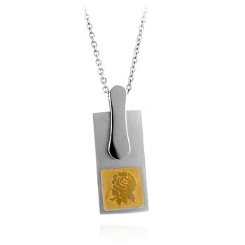 Stainless steel pendant with a cut-out floral silhouette design