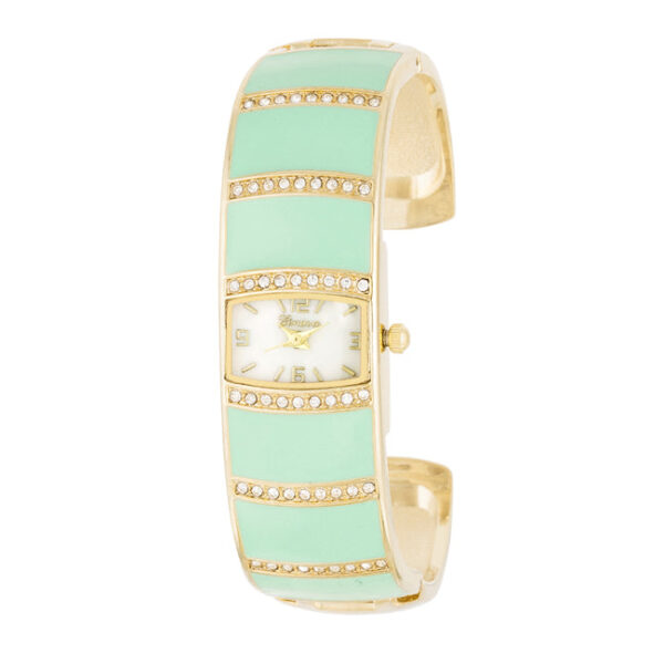 Gold cuff watch in mint with crystals set around the round watch face