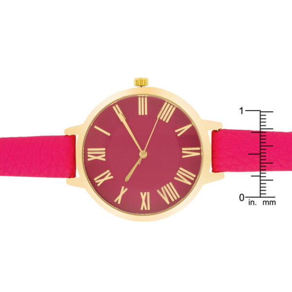 Watch face shown up close with pink leather strap in the background
