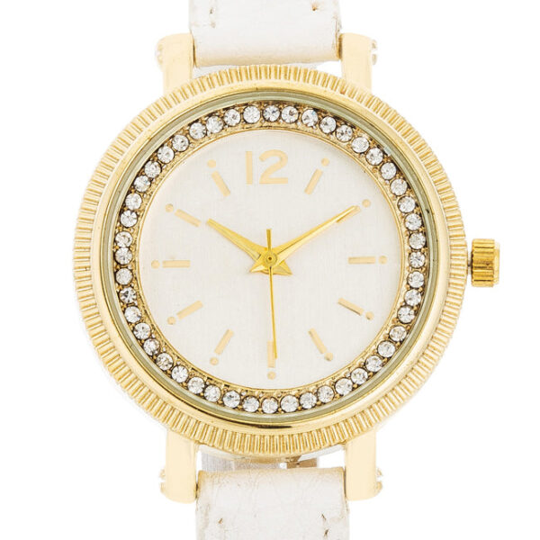 Close view of the crystal-studded bezel on the round gold-tone watch face