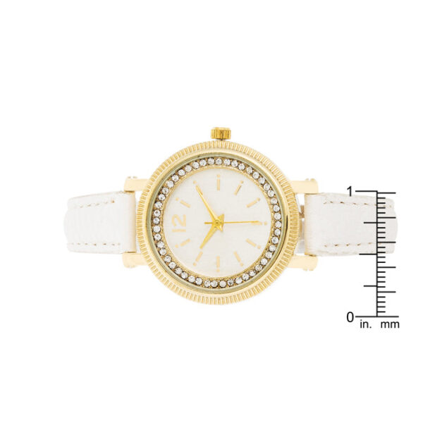 White leather strap of the watch shown alongside the gold-tone case