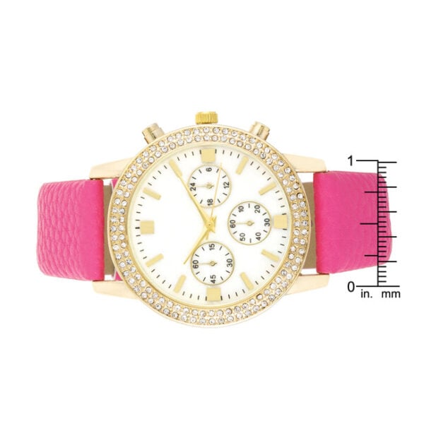 Side angle of the gold-tone watch showing the case and band construction
