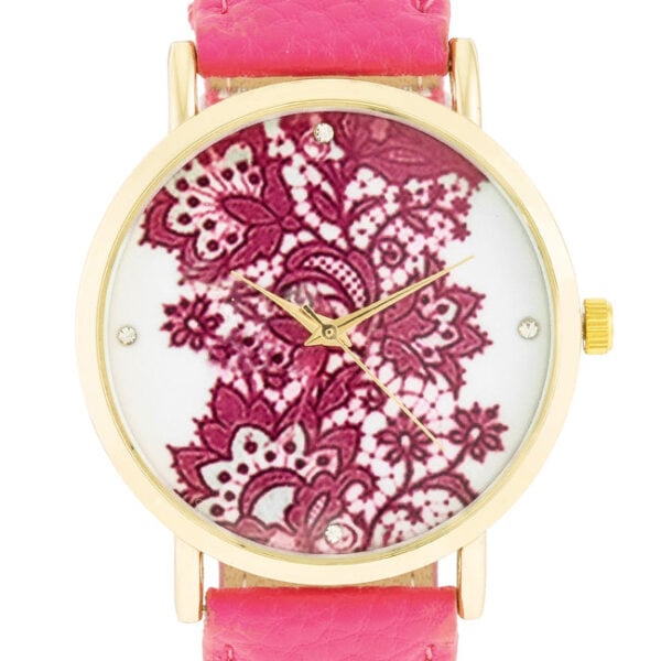 Side angle of the gold-tone watch showing the plated stainless steel case