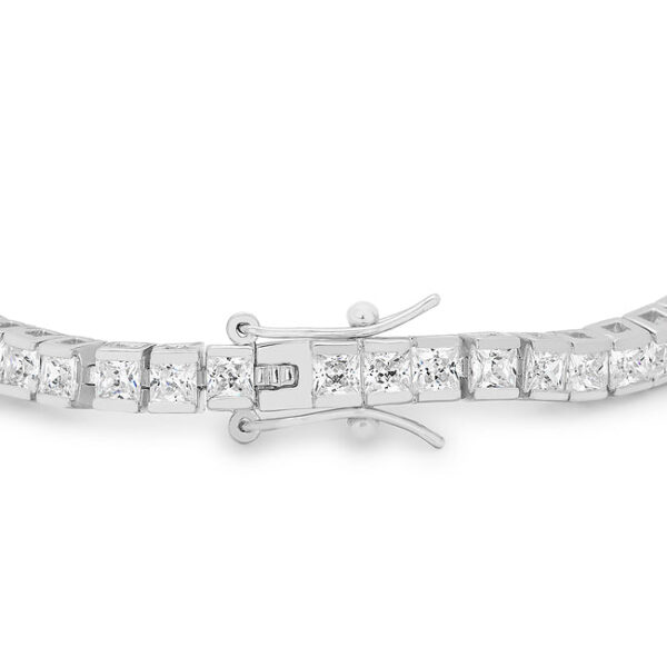 Close-up of prong-set pink cubic zirconia stones on a rhodium plated tennis bracelet