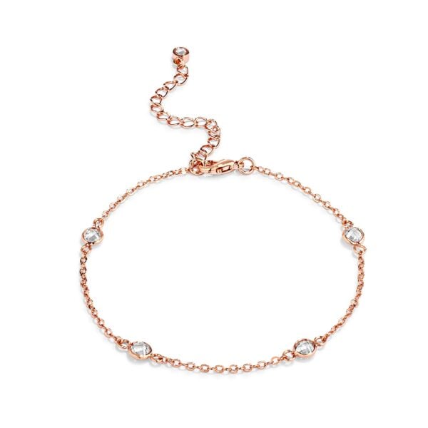 Rose goldtone plated bracelet with round bezel-set clear CZ stones in a Saturn pattern, lobster clasp visible