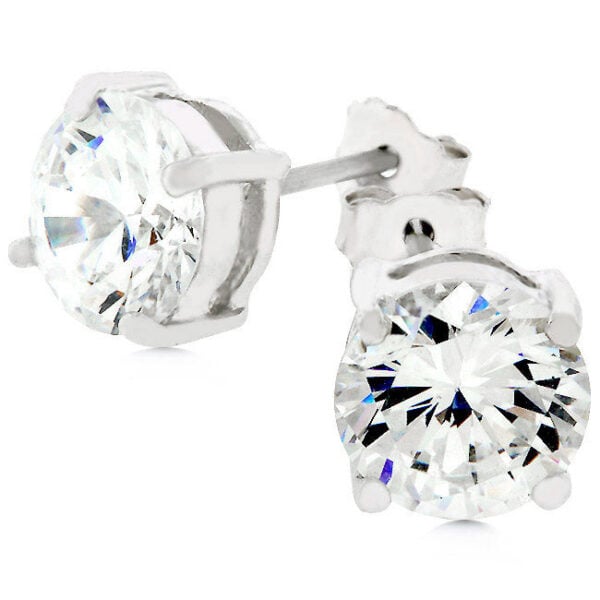 Pair of round cubic zirconia stud earrings in rhodium plated sterling silver on a display surface