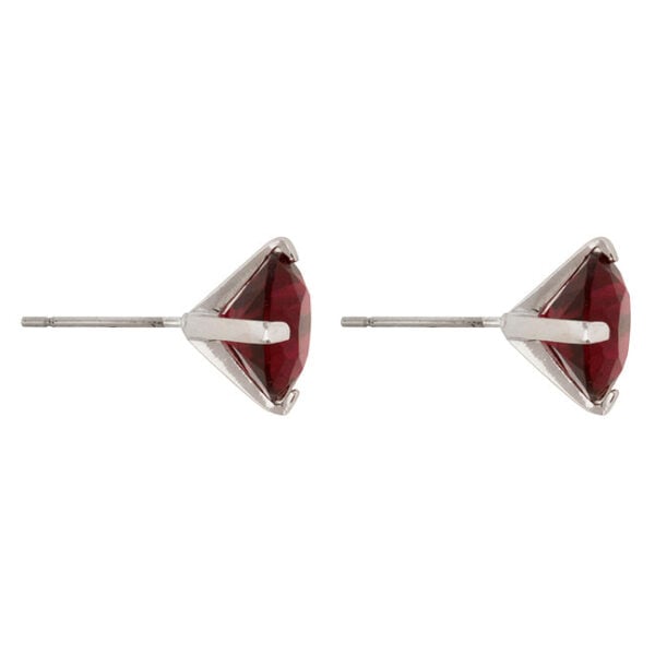 Side angle of a ruby-colored cubic zirconia stud earring showing prong setting and butterfly post back