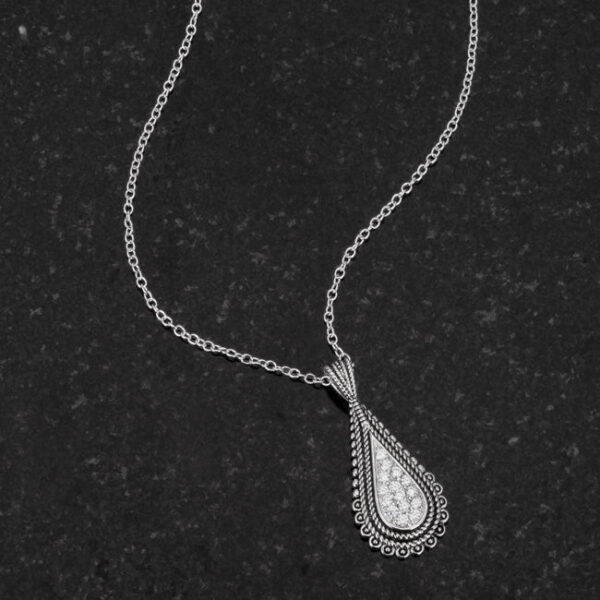 Round cubic zirconia tear drop pendant necklace with 1.8 (mm) accent stones and a lobster clasp.