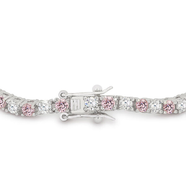 Round pink cubic zirconia in prong settings on a rhodium plated over lead free alloy (brass) tennis bracelet.